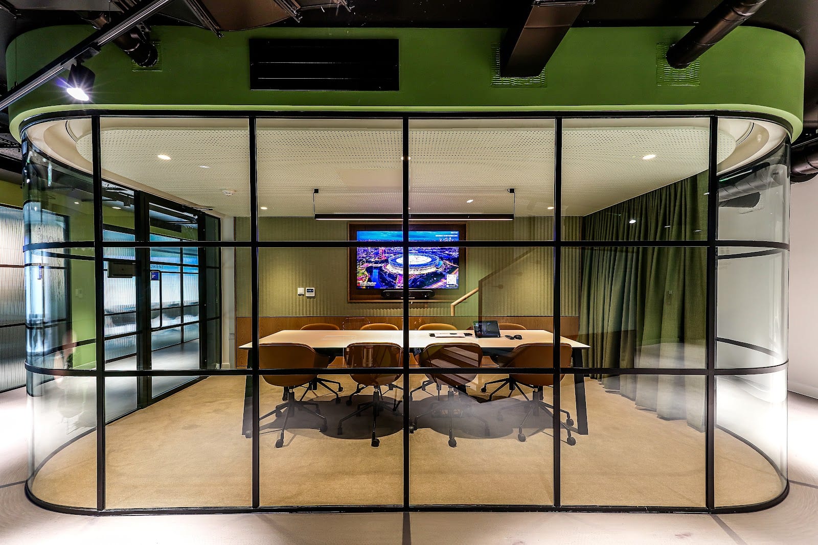 Populous Architects headquarters interior featuring stadium-inspired running track
