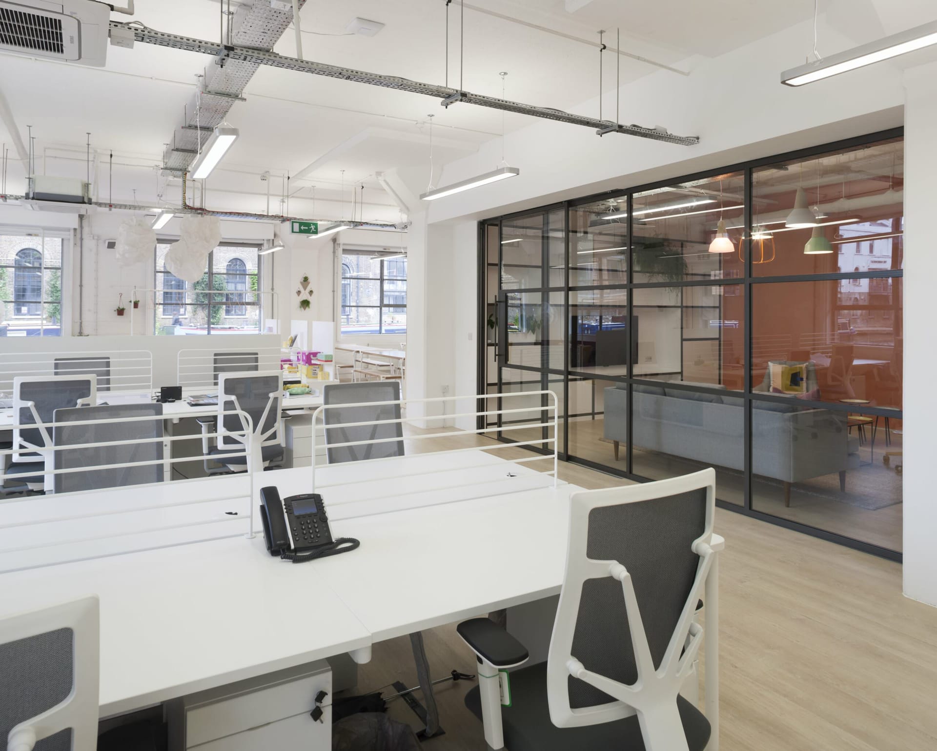 Bespoke Cat B office fit-out with integrated acoustic ceiling and workstations